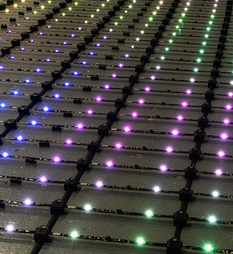 Outdoor facade illuminated by the LumiPix pixel-controlled RGB low res video system